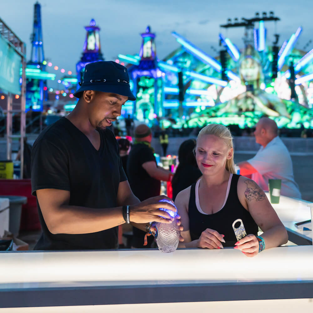 team of bartenders making a drink