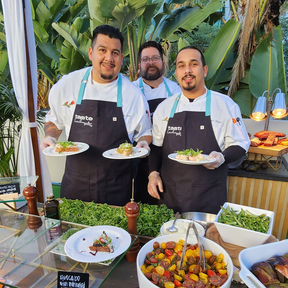 Three happy male servers