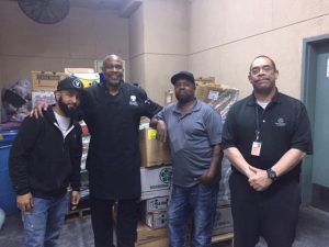 Levy members helping deliver food donations at the STAPLES Center